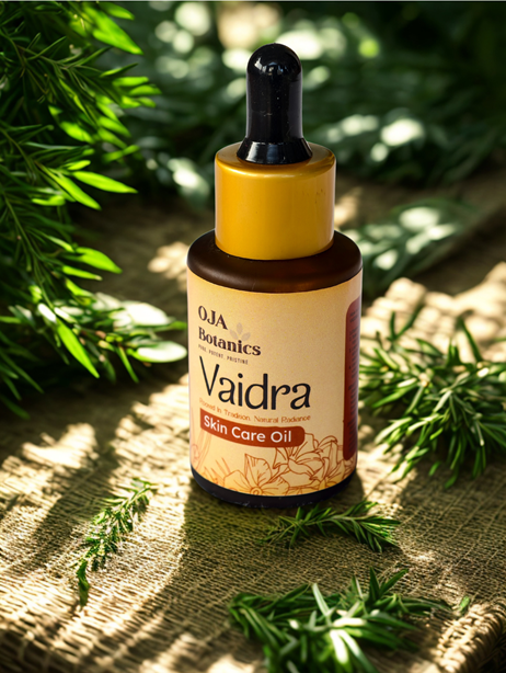 OJA Botanics Vaidra Skin Care Oil bottle with green leaves in the background