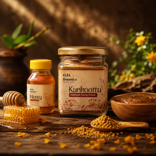Jar of OJA Botanics Kurikoottu Herbal Face Pack with honey and wooden spoon on a rustic background