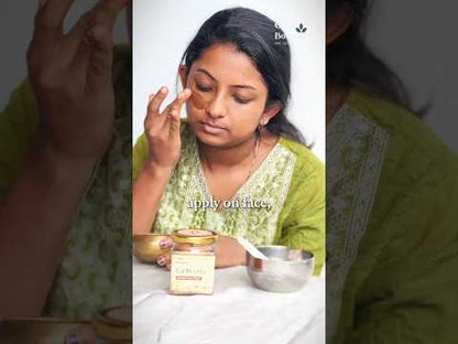 Oja Botanics Founder showing how to use KURIKOOTTU herbal facepack.